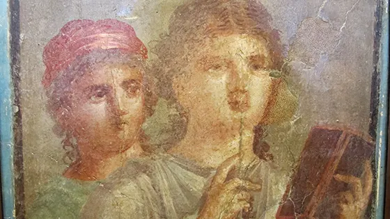 A fresco of two people with a stylus and wax tablet