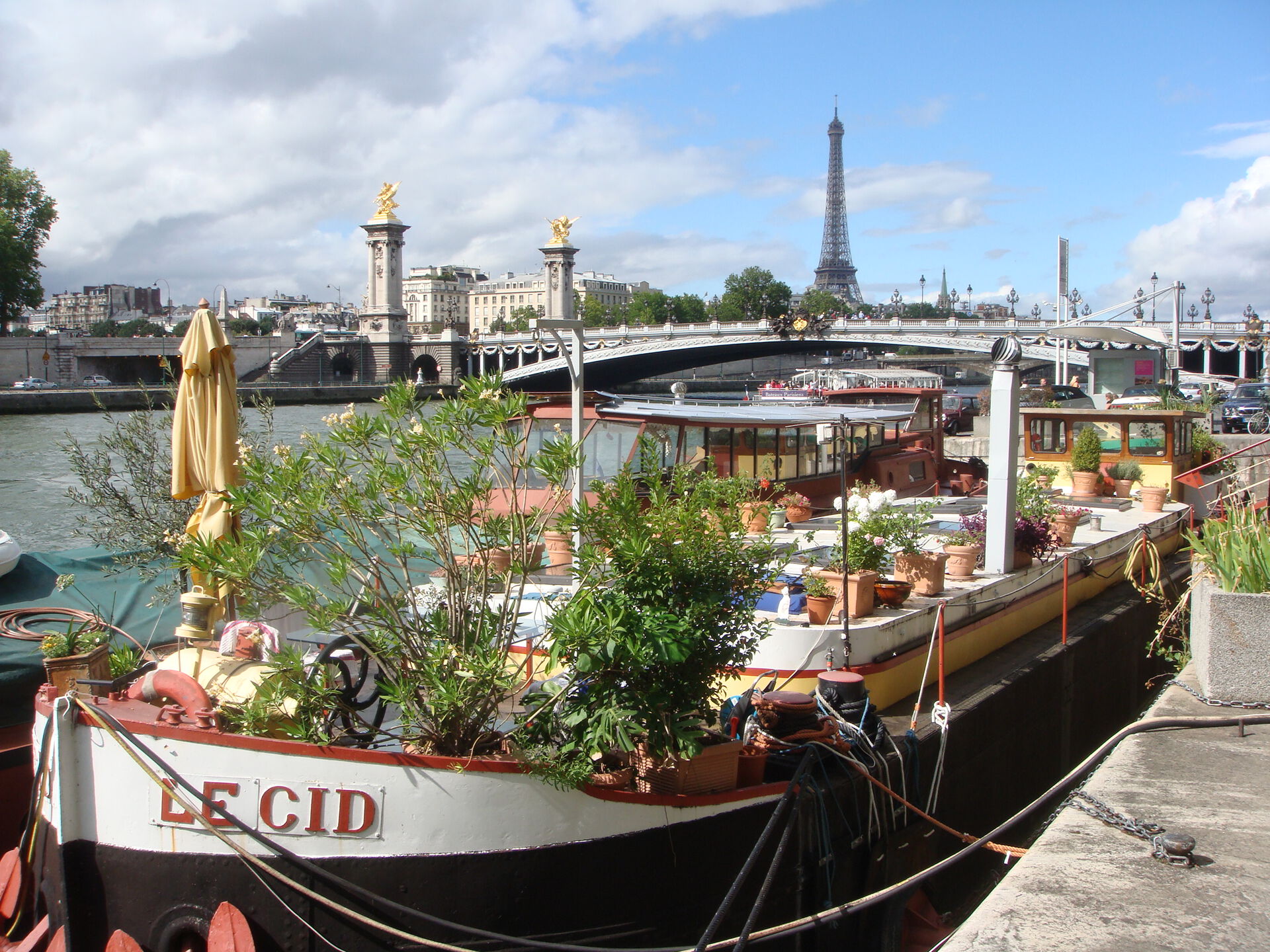 Photo from Paris with boat in the foreground and the Eifel Tower in the background